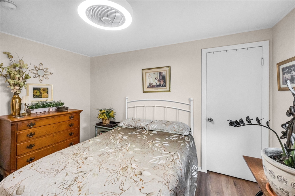 98 Pine Grove Street Springfield, MA 01119 - Photo 27 of 39 a bed room with a bed and a television