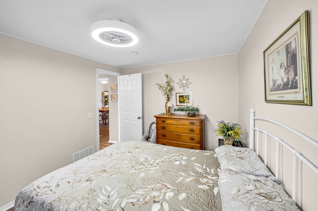 98 Pine Grove Street Springfield, MA 01119 - Photo 28 of 39 a bedroom with a bed and a dresser