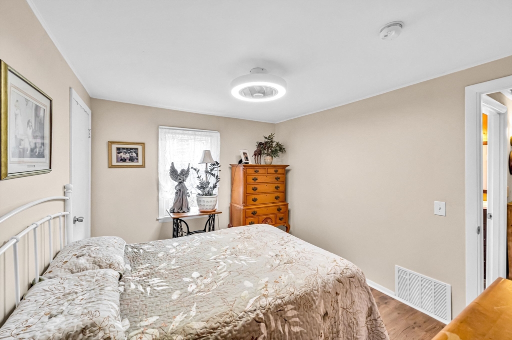 98 Pine Grove Street Springfield, MA 01119 - Photo 29 of 39 a bedroom with a bed and a dresser