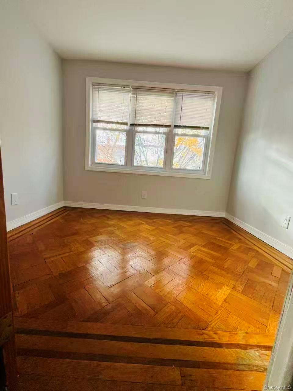 84-33 124th Street Queens, NY 11415 - Photo 20 of 27 a view of an empty room with window