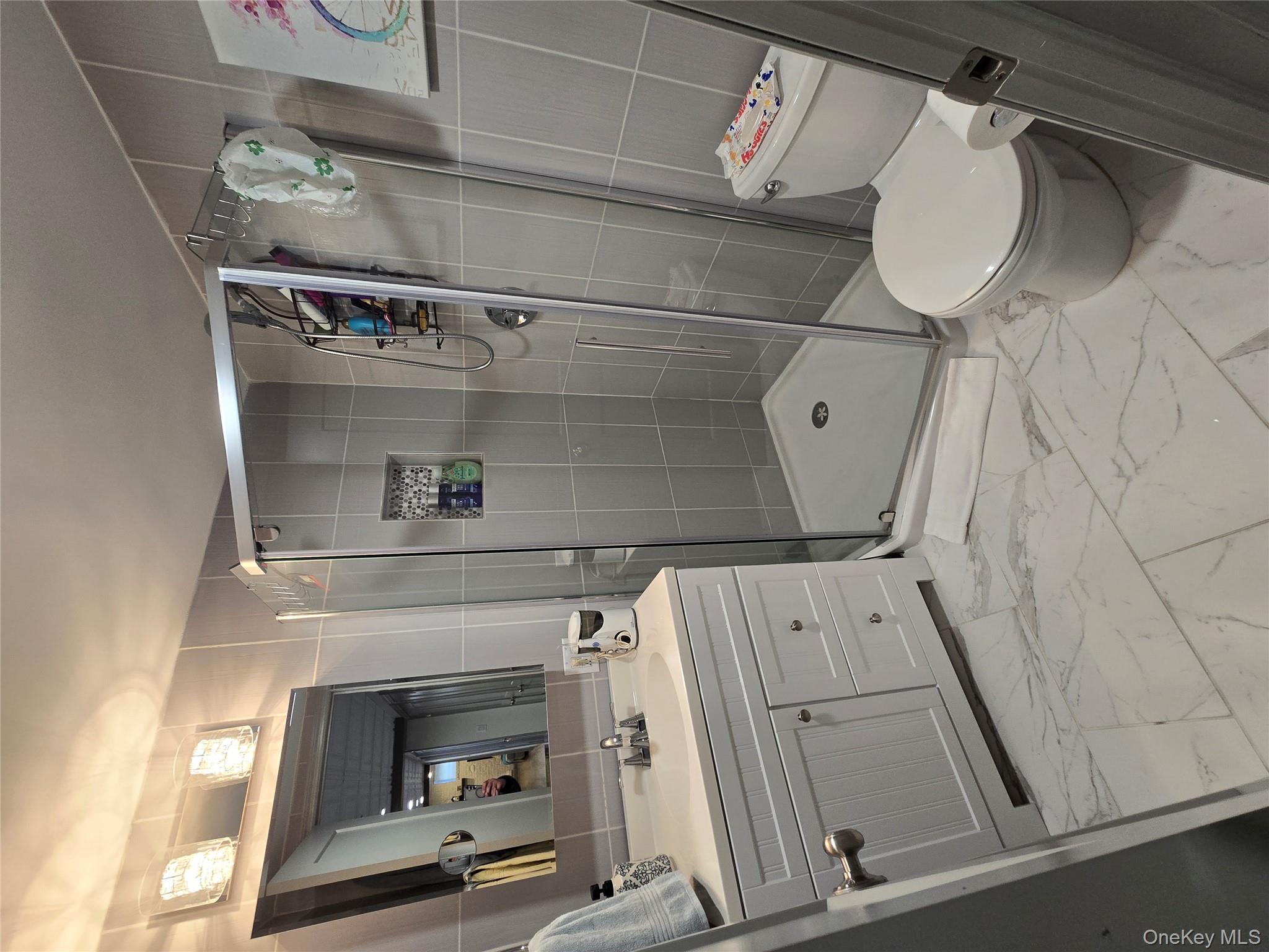 84-33 124th Street Queens, NY 11415 - Photo 25 of 27 a bathroom with a sink toilet and shower