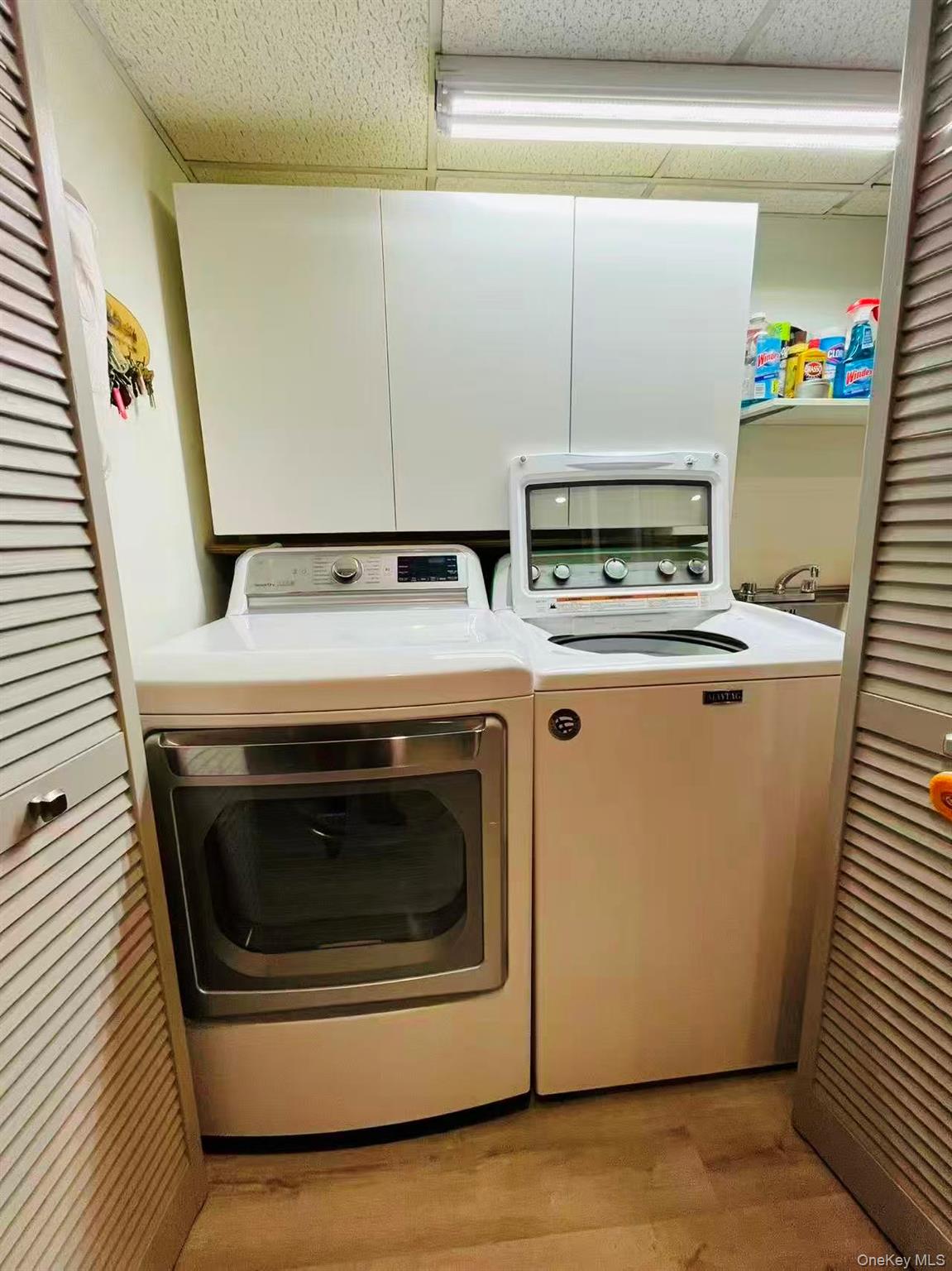 84-33 124th Street Queens, NY 11415 - Photo 27 of 27 a utility room with dryer and washer