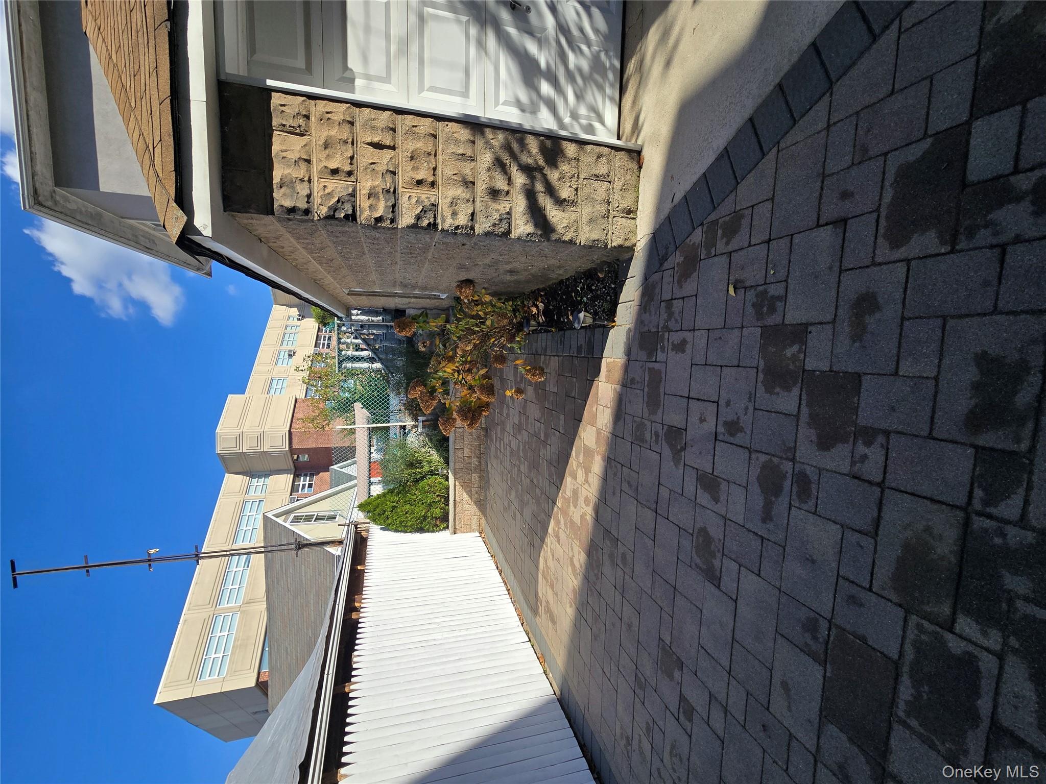 84-33 124th Street Queens, NY 11415 - Photo 3 of 27 a front view of a house with a yard