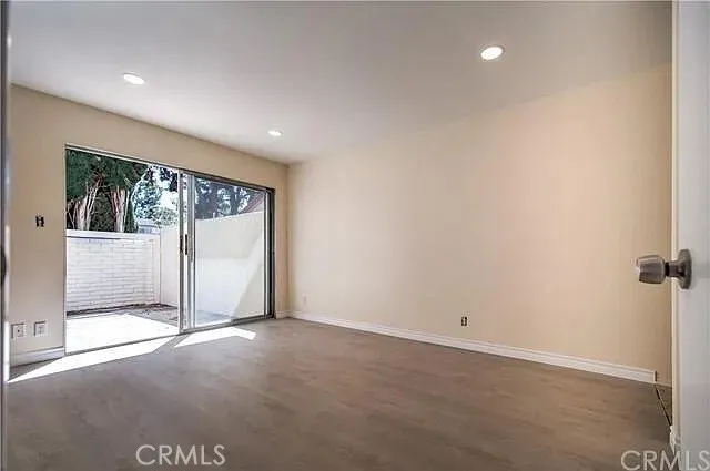 an empty room with sliding door