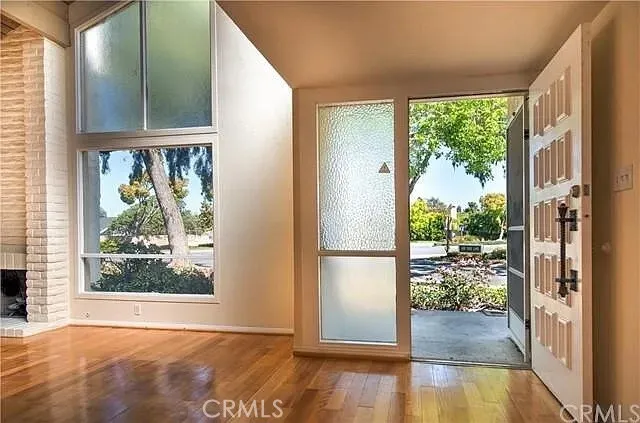 a view of a room that has a large window