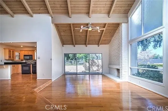 a view of livingroom with wooden floor and floor to ceiling window with wooden floor