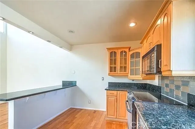 a bathroom with a granite countertop sink and a granite counter top