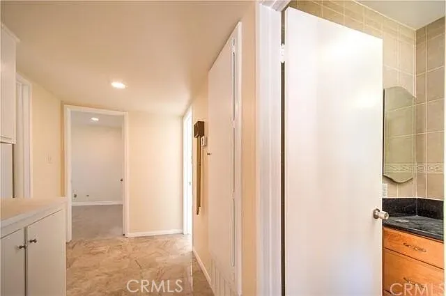 a view of a bathroom with a shower and a sink