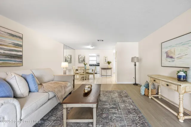 a living room with furniture and a rug
