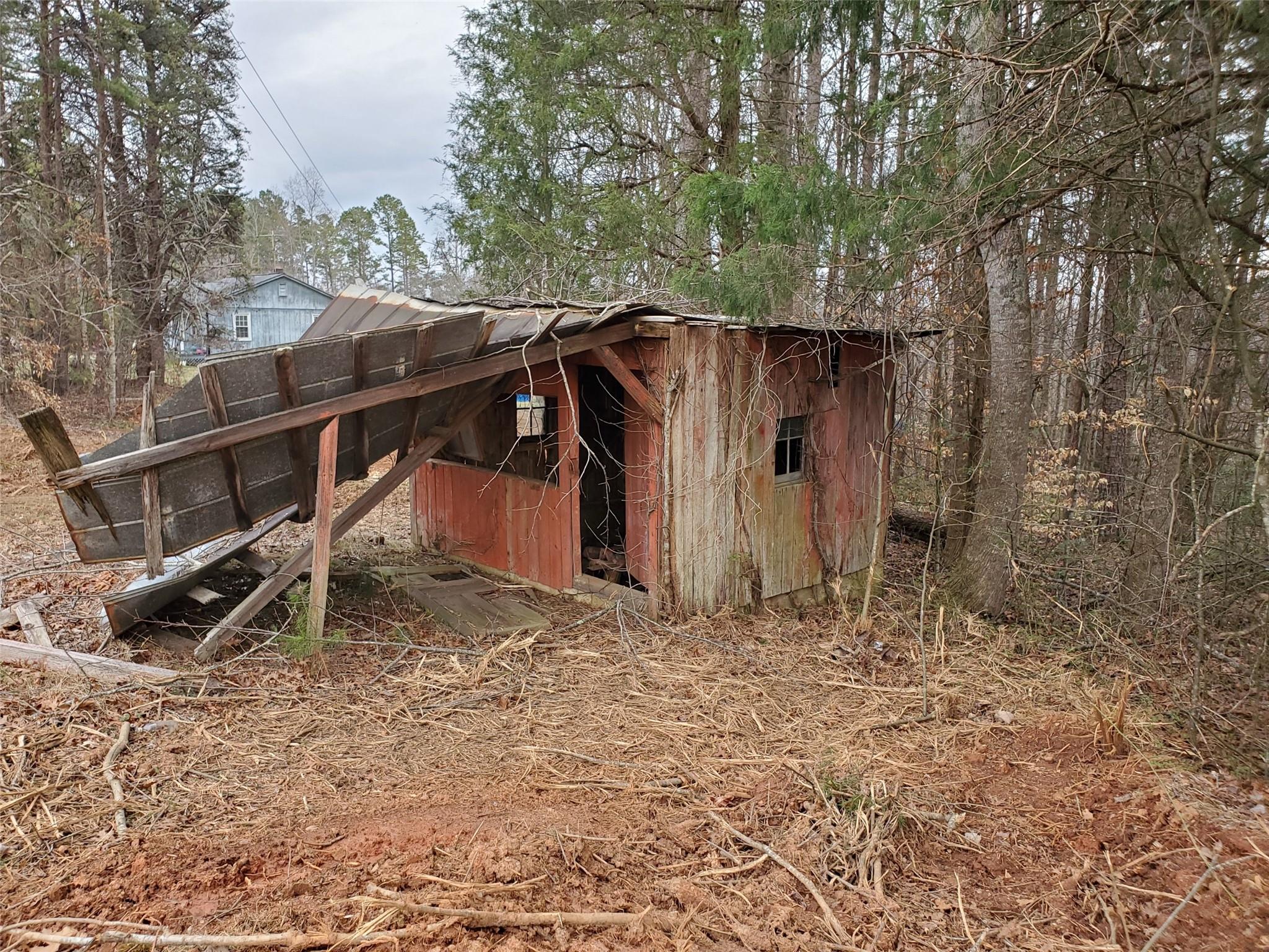 3752 Nc Highway Vale, NC 28168 - Photo 6 of 10 a view of a wooden house with a yard and large trees