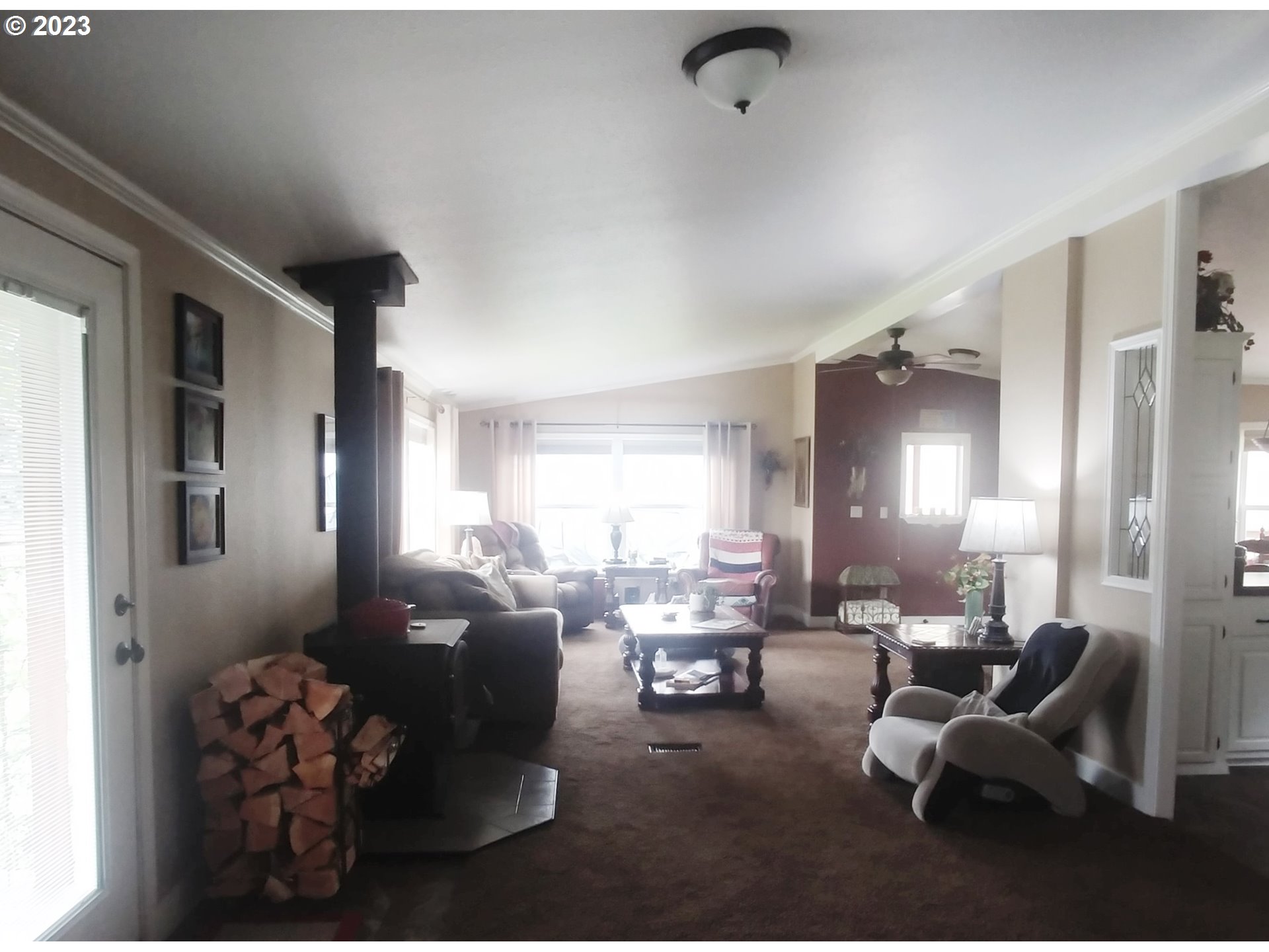700 North Russell Street Joseph, OR 97846 - Photo 12 of 34 a living room with furniture and a large window