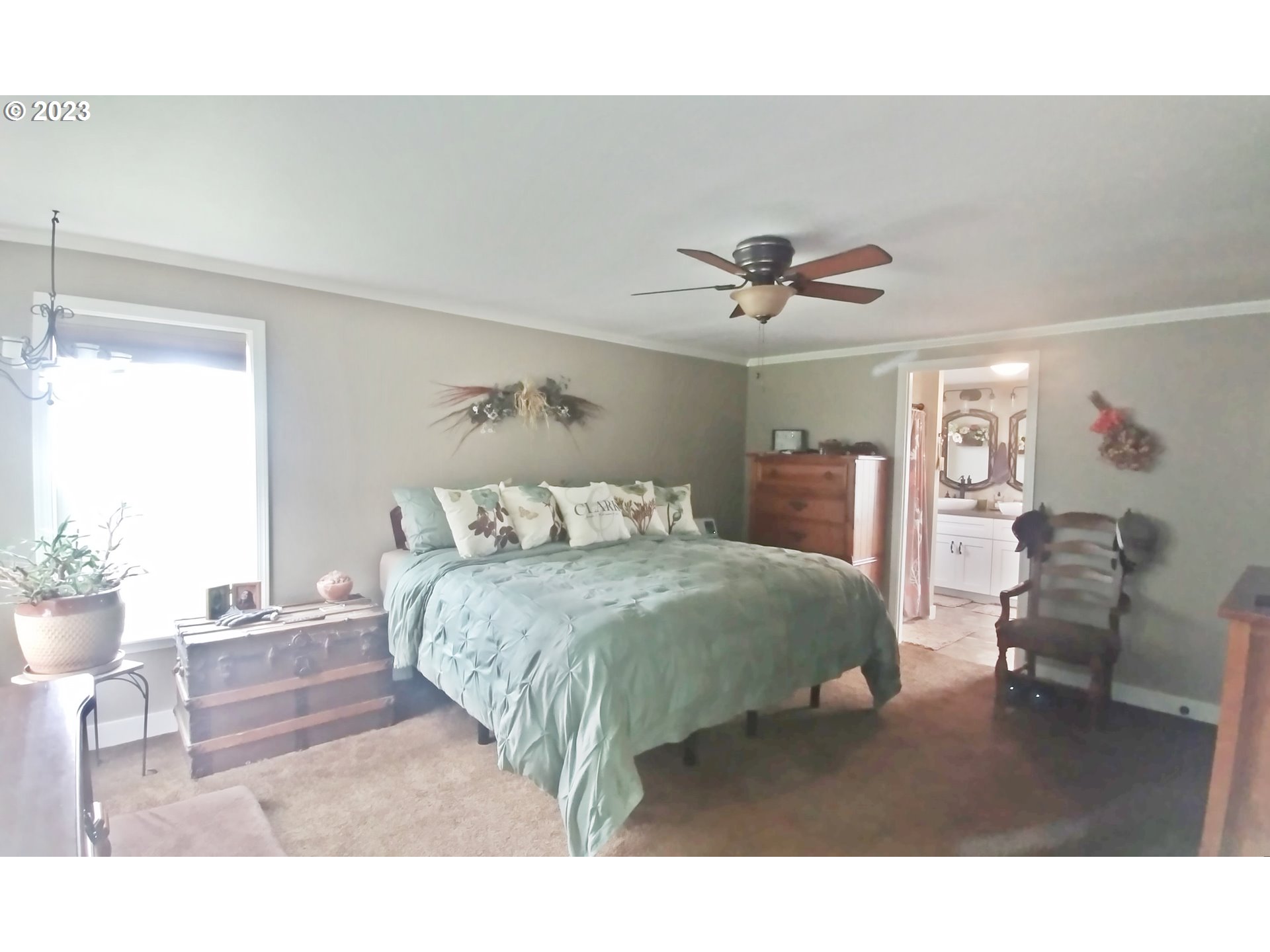 700 North Russell Street Joseph, OR 97846 - Photo 21 of 34 a bedroom with a bed and a chandelier
