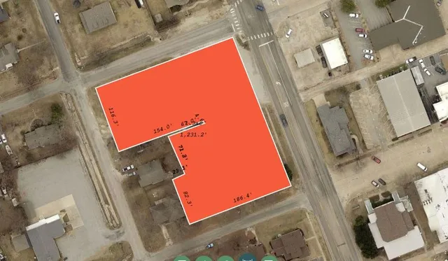 an aerial view of a residential apartment building with a front door