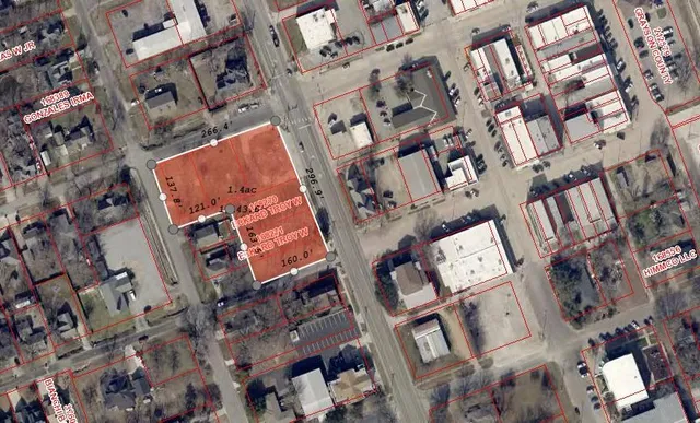 an aerial view of a building with a lot of stuff