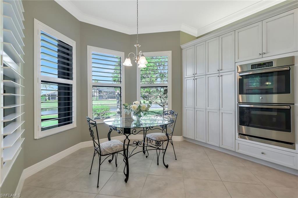 3384 Atlantic Circle Naples, FL 34119 - Photo 13 of 50 a view of a dining room with furniture window and outside view