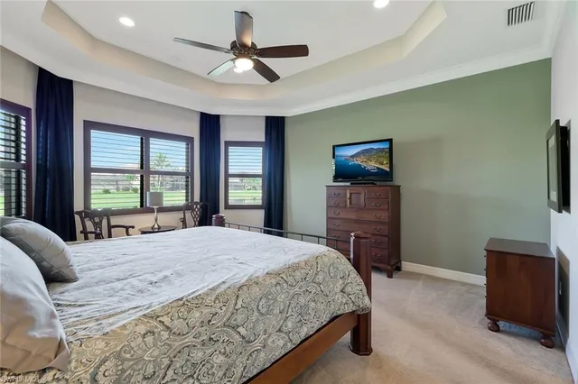 a bedroom with a bed and a flat screen television