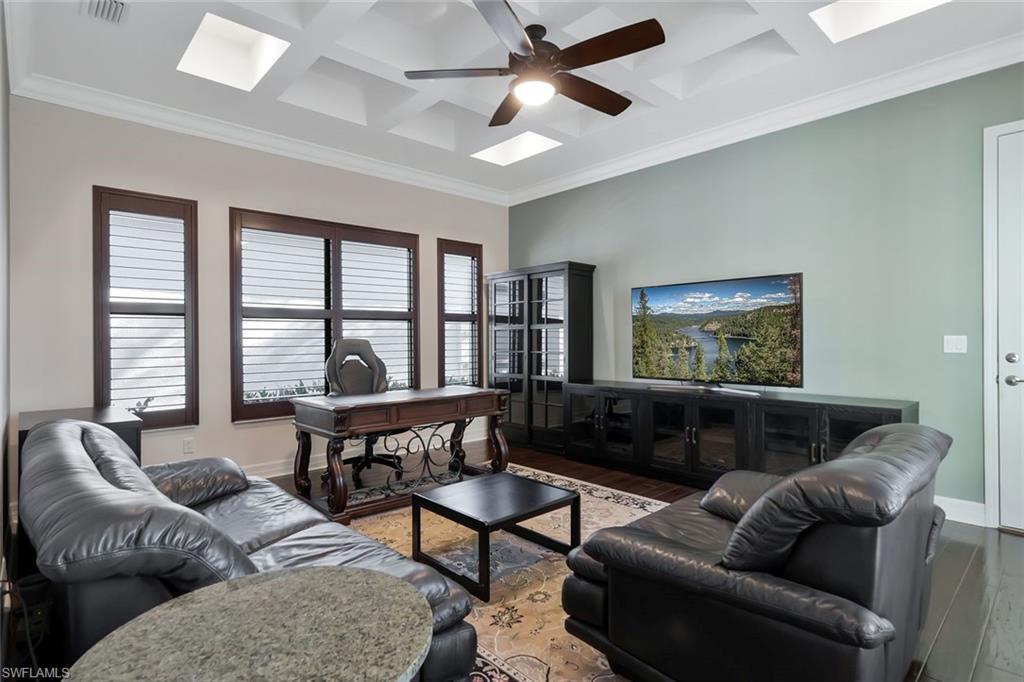 3384 Atlantic Circle Naples, FL 34119 - Photo 23 of 50 a living room with furniture and a window