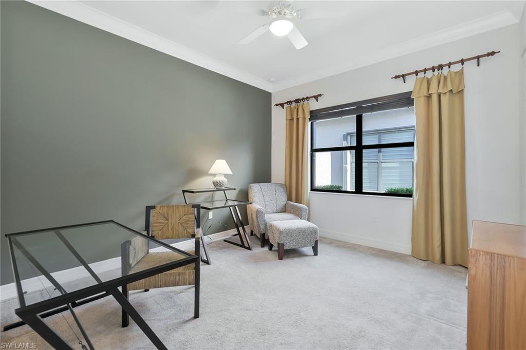 3384 Atlantic Circle Naples, FL 34119 - Photo 26 of 50 a living room with furniture and a window