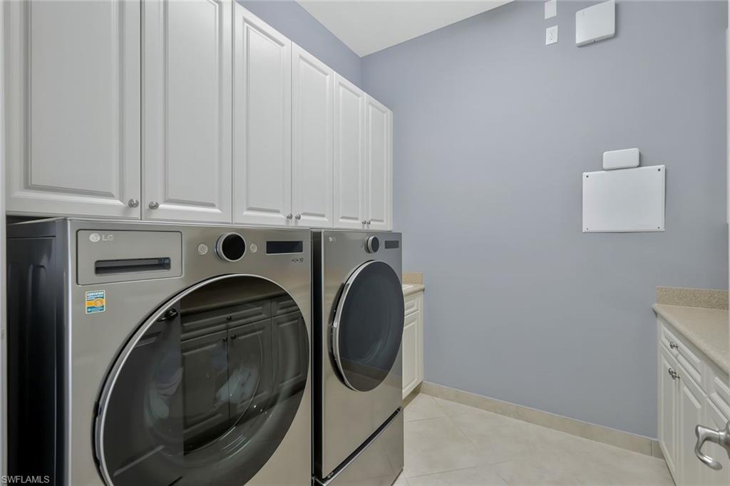 3384 Atlantic Circle Naples, FL 34119 - Photo 30 of 50 a utility room with dryer and washer