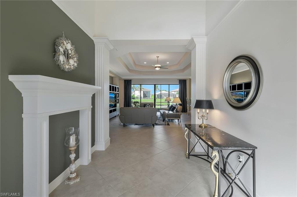 3384 Atlantic Circle Naples, FL 34119 - Photo 32 of 50 a living room with furniture and a fireplace