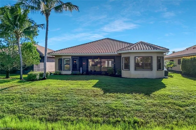 a front view of a house with a yard table and chairs