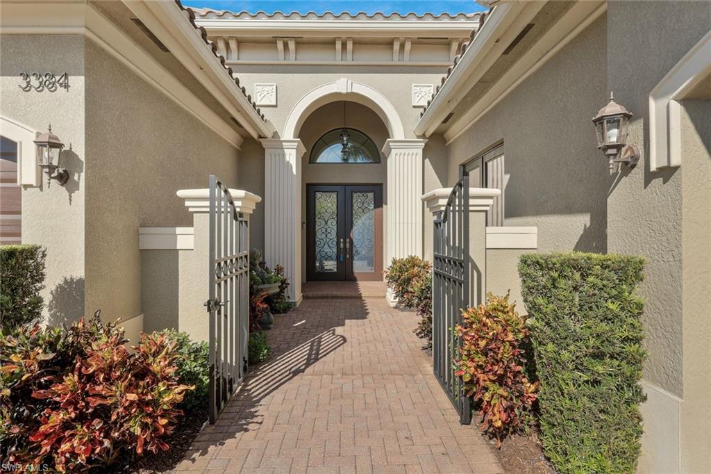 3384 Atlantic Circle Naples, FL 34119 - Photo 39 of 50 a view of entryway and hall with wooden floor