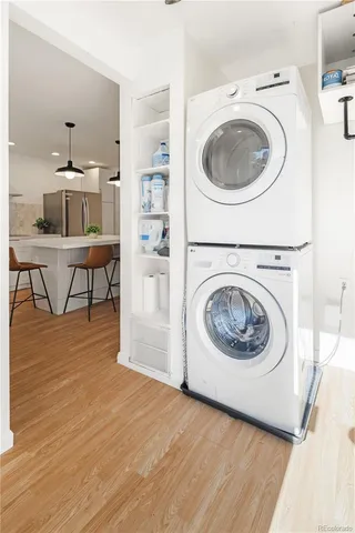 a view of a kitchen with a washer and dryer in it