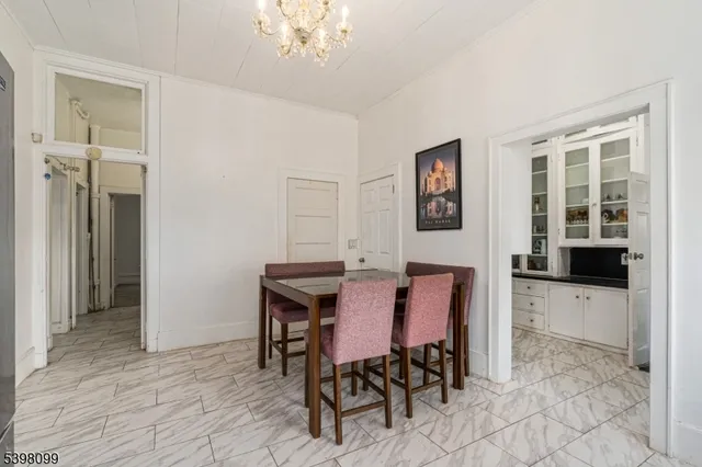 an empty room with closet and a fireplace