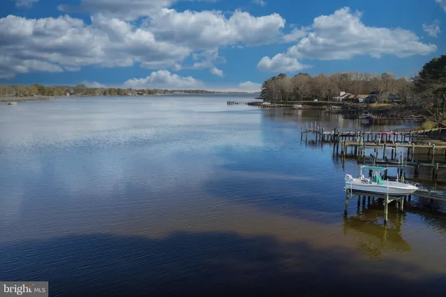a view of a lake with outdoor seating