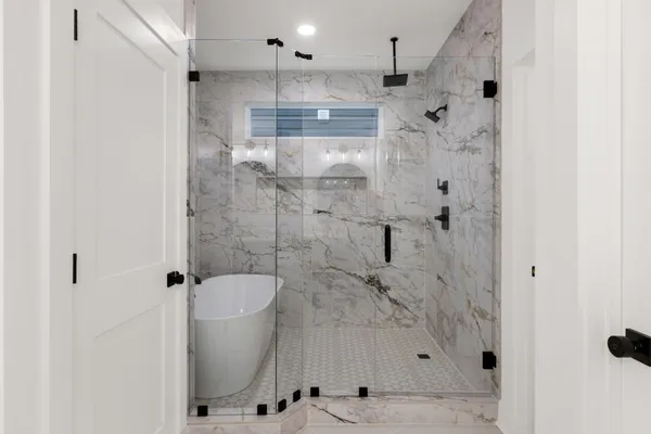 a bathroom with a shower and toilet