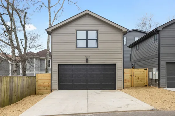 a front view of a house with garage