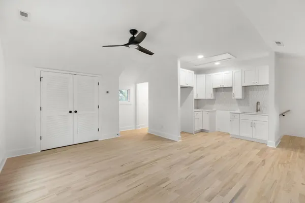 a view of a kitchen with marble kitchen and refrigerator