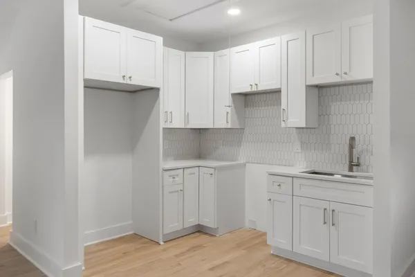 a view of cabinets and wooden floor