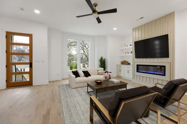 a living room with furniture and a flat screen tv