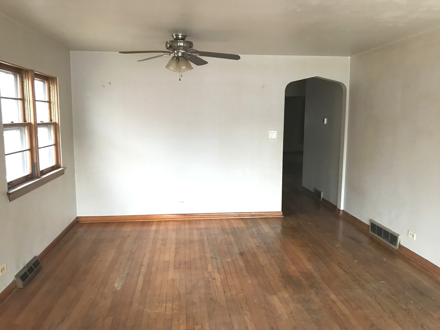 7331 Ogden Avenue Lyons, IL 60534 - Photo 14 of 15 a view of an empty room with a window and wooden floor