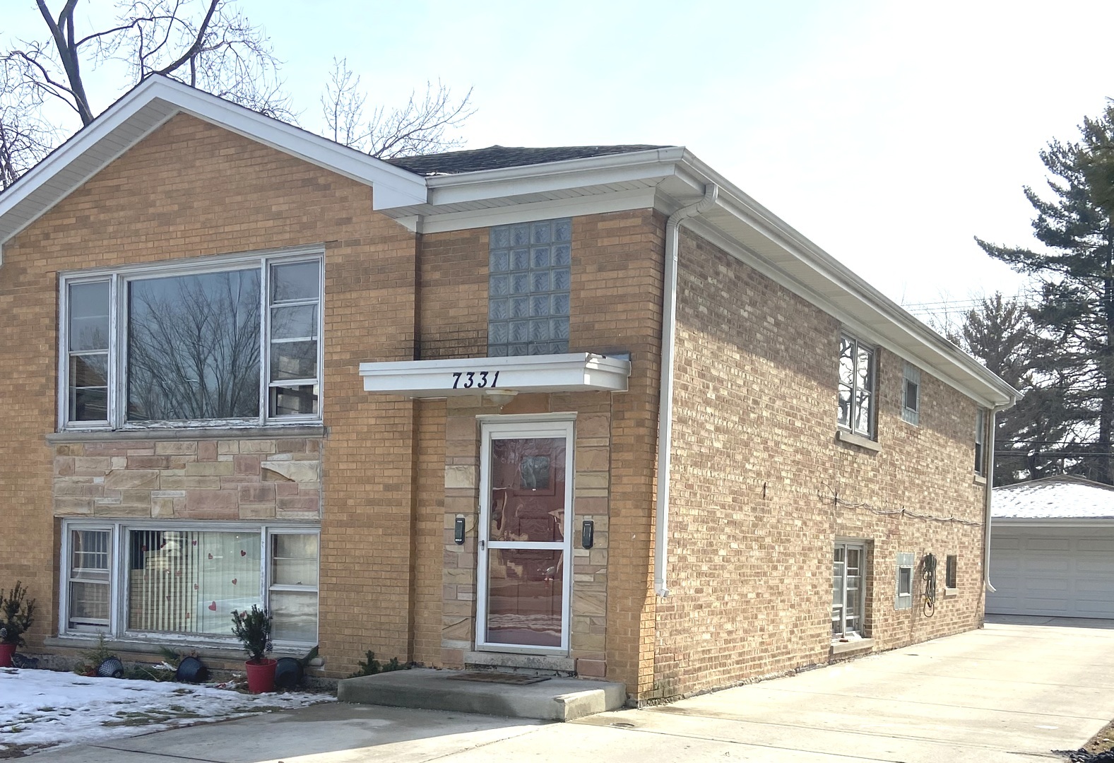 7331 Ogden Avenue Lyons, IL 60534 - Photo 3 of 15 a front view of a house with a garden