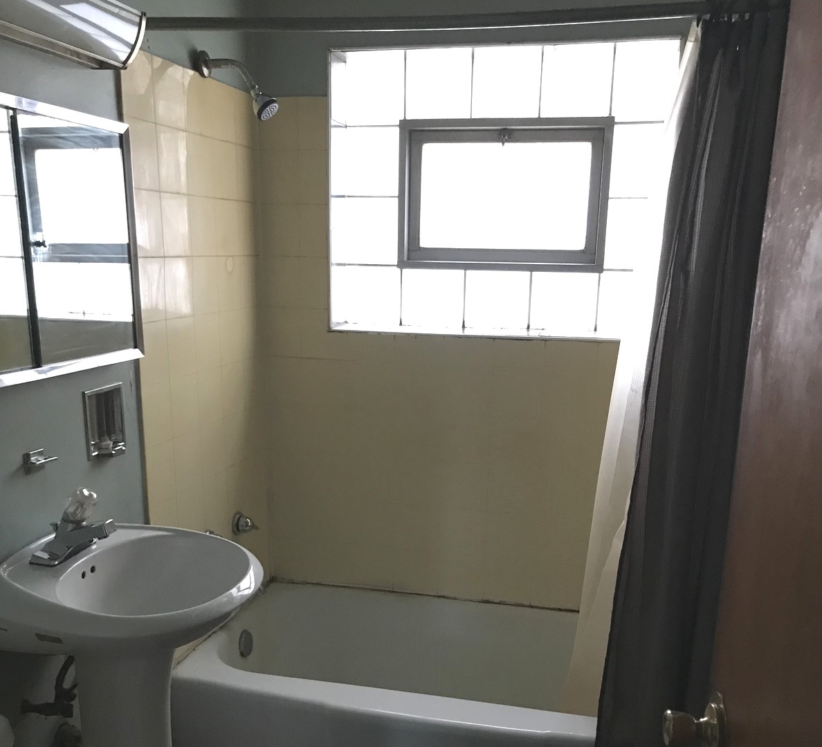 7331 Ogden Avenue Lyons, IL 60534 - Photo 10 of 15 a bathroom with a sink a window and a mirror