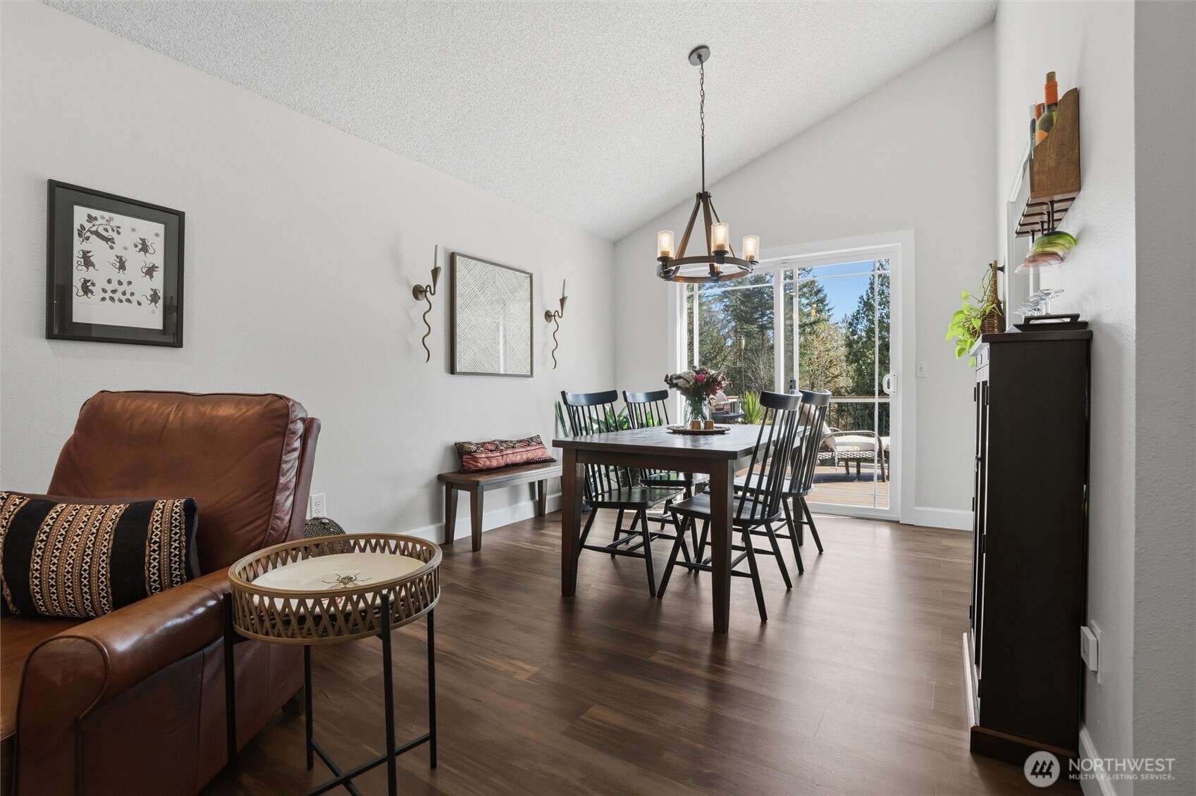 2065 Opdal Road East Port Orchard, WA 98366 - Photo 12 of 40 a dining room with furniture a chandelier and wooden floor
