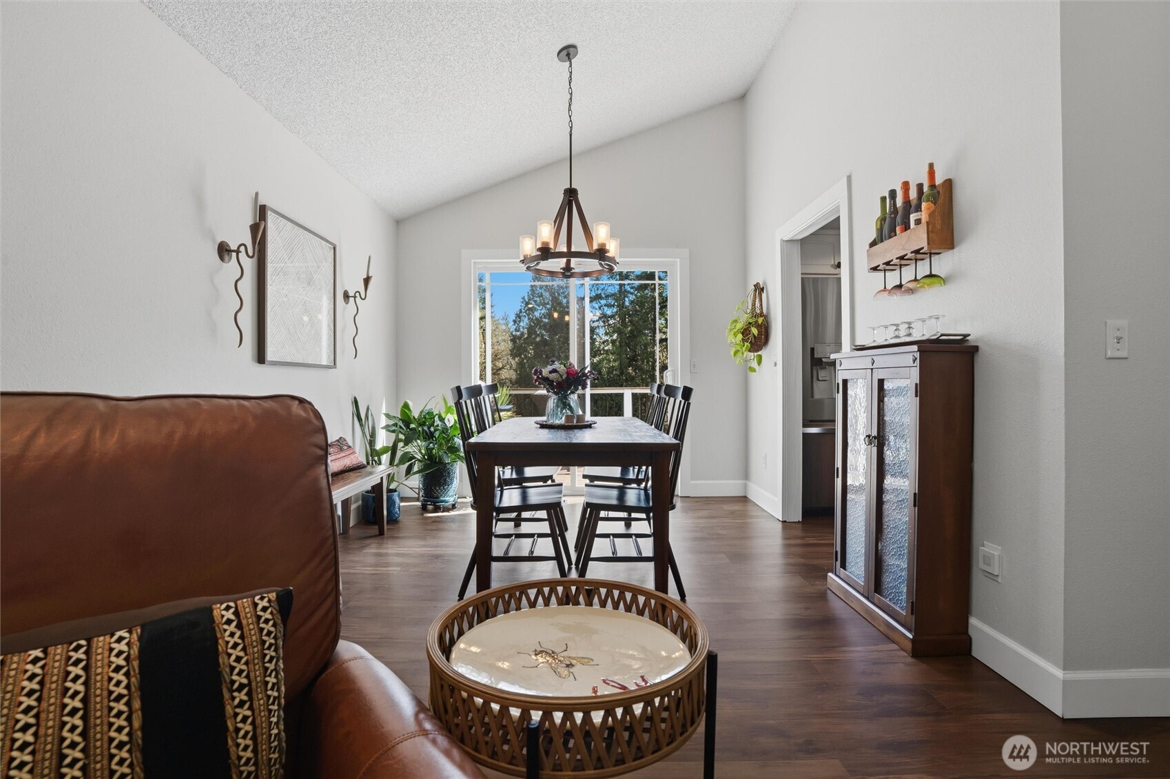 2065 Opdal Road East Port Orchard, WA 98366 - Photo 13 of 40 a dining room with furniture a chandelier and wooden floor