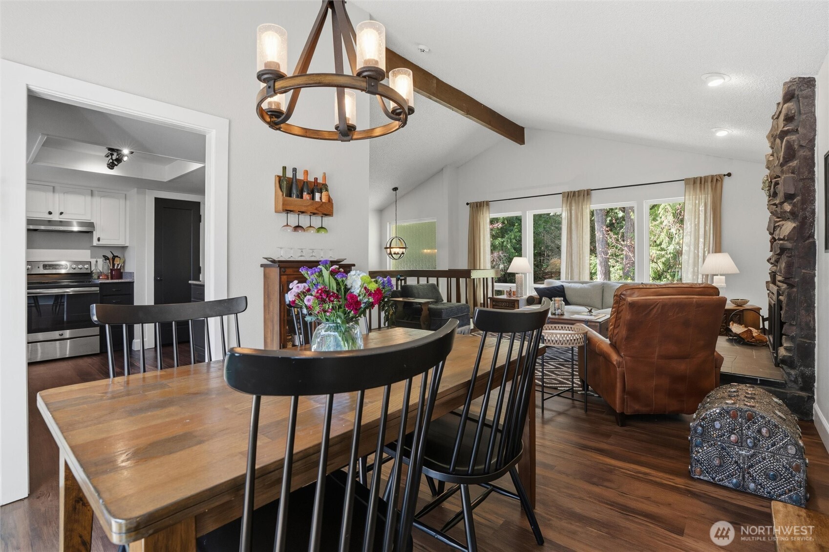 2065 Opdal Road East Port Orchard, WA 98366 - Photo 15 of 40 a view of a dining room with furniture and a chandelier
