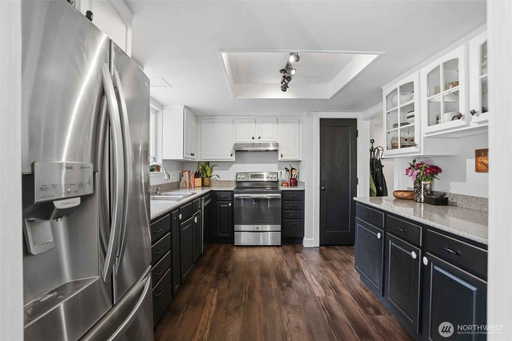 2065 Opdal Road East Port Orchard, WA 98366 - Photo 16 of 40 a kitchen with stainless steel appliances a refrigerator sink and cabinets