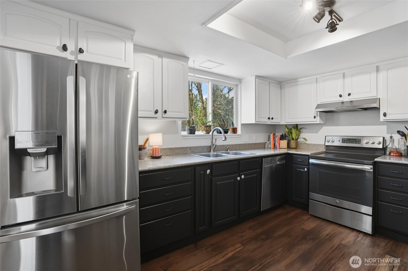 2065 Opdal Road East Port Orchard, WA 98366 - Photo 17 of 40 a kitchen with a sink stainless steel appliances and cabinets