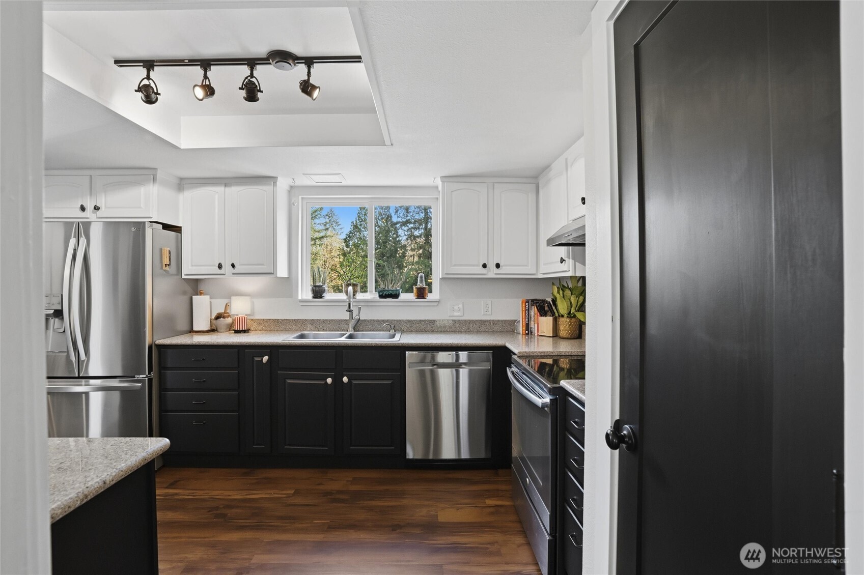 2065 Opdal Road East Port Orchard, WA 98366 - Photo 18 of 40 a kitchen with stainless steel appliances granite countertop a sink stove and refrigerator