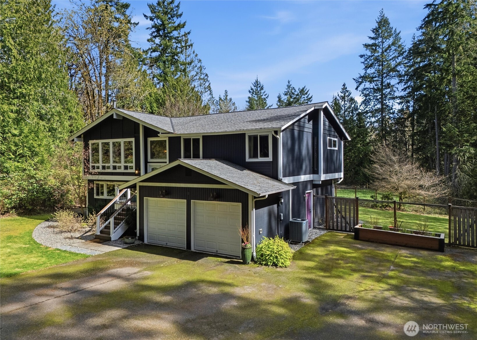2065 Opdal Road East Port Orchard, WA 98366 - Photo 2 of 40 a front view of a house with a yard