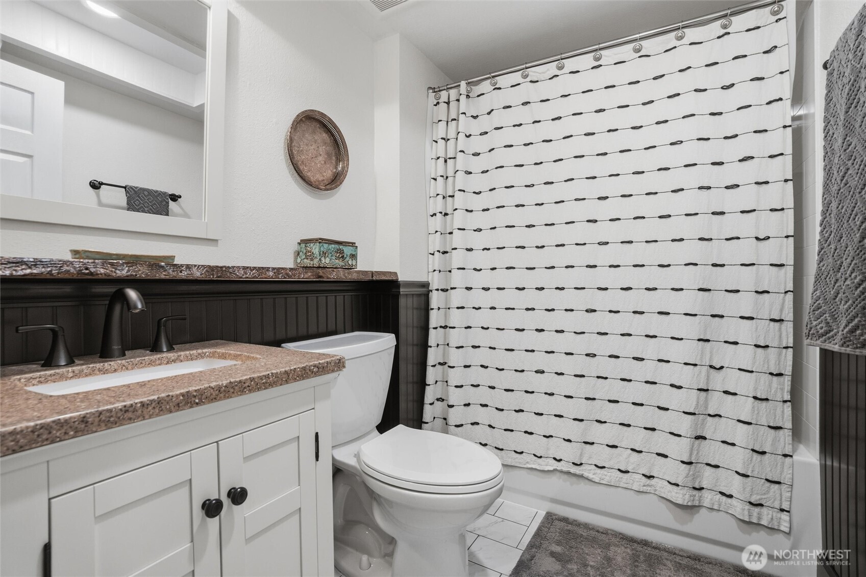 2065 Opdal Road East Port Orchard, WA 98366 - Photo 22 of 40 a bathroom with a sink a toilet and a mirror