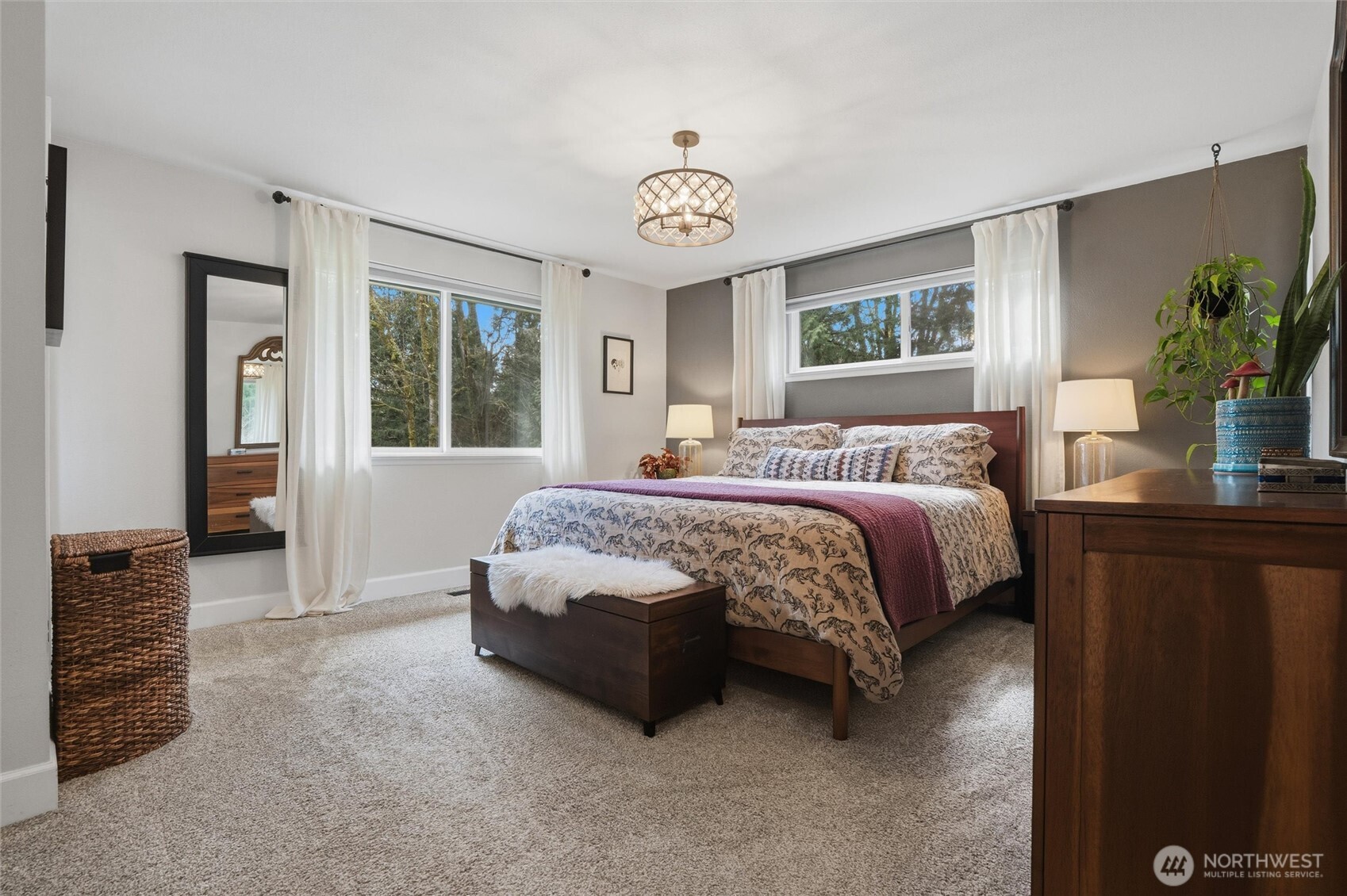 2065 Opdal Road East Port Orchard, WA 98366 - Photo 24 of 40 a spacious bedroom with a bed and a table