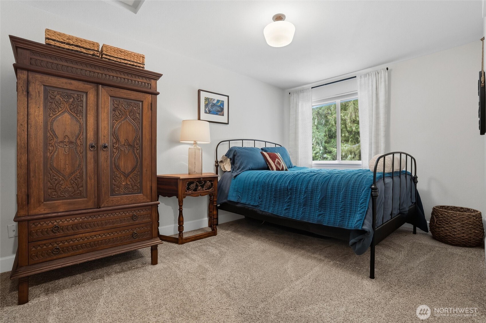 2065 Opdal Road East Port Orchard, WA 98366 - Photo 28 of 40 a bedroom with a bed and a dresser