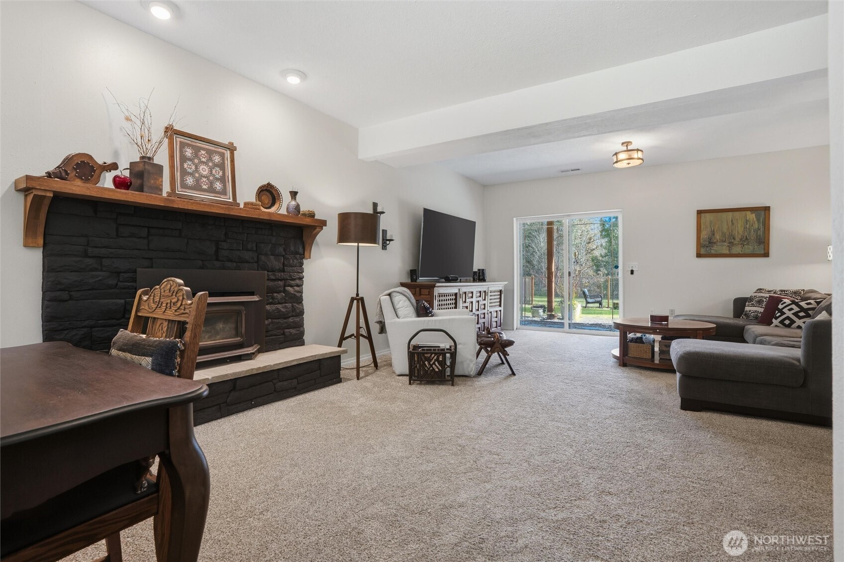 2065 Opdal Road East Port Orchard, WA 98366 - Photo 30 of 40 a view of a livingroom with furniture and a fireplace