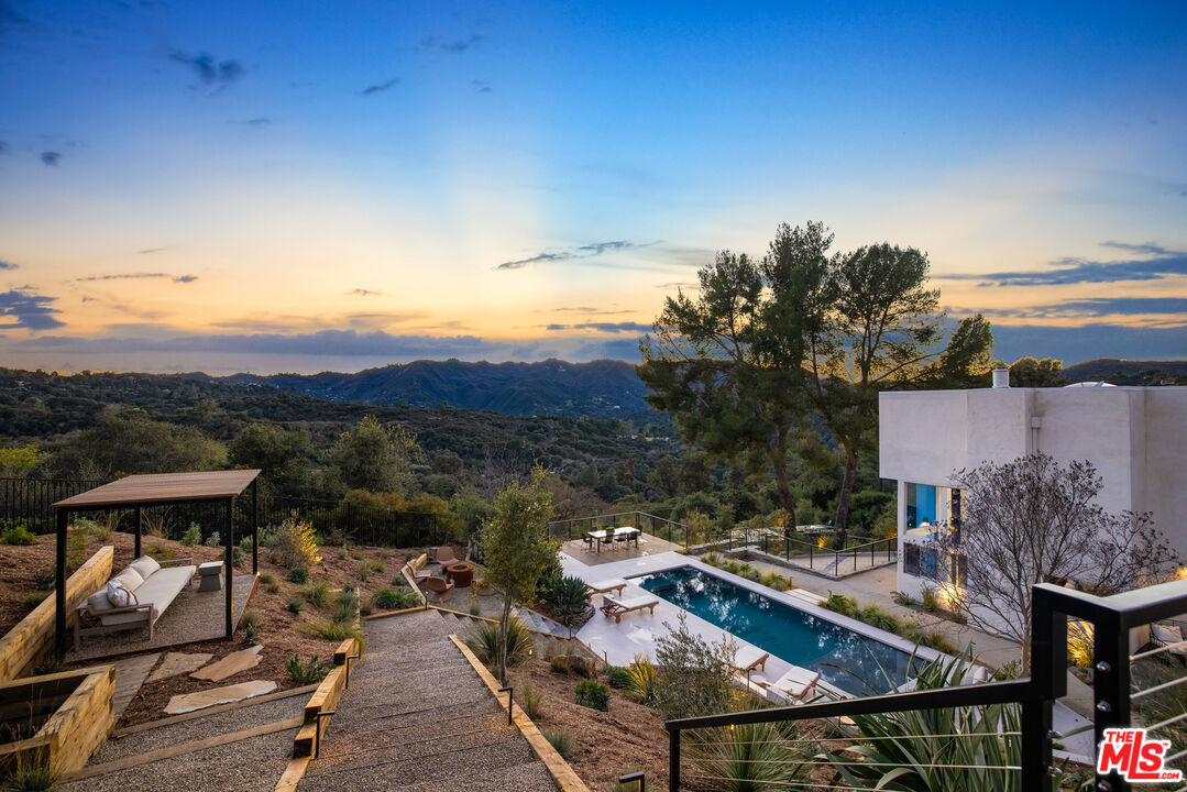 a view of houses with an outdoor space and seating