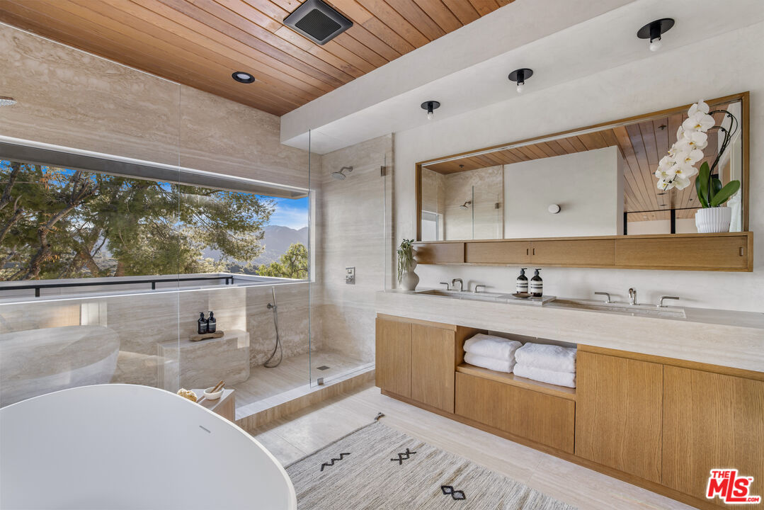 20711 Hillside Drive Topanga, CA 90290 - Photo 17 of 41 a living room with stainless steel appliances granite countertop furniture and a large window